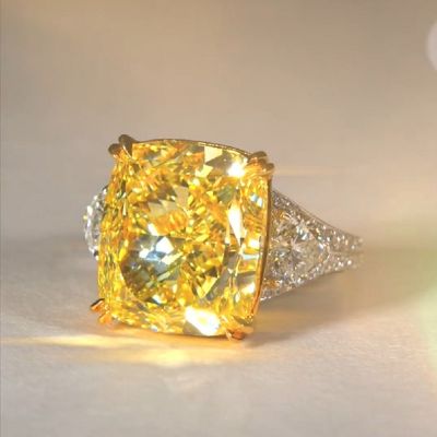 17.0 Carat Cushion Cut Yellow Diamond Ring With Two Hearts Side Stones