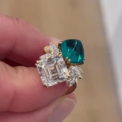 5.82 Carat Diamond And  4.31 Carat Sugarloaf Emerald Split Shank Crossover Engagement Ring